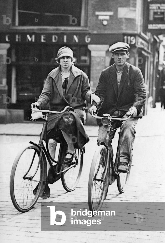 Couple on bikes, 1924