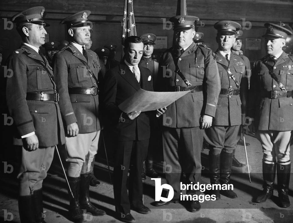 Buster Keaton with members of the National Guard, 1928 (b/w photo)