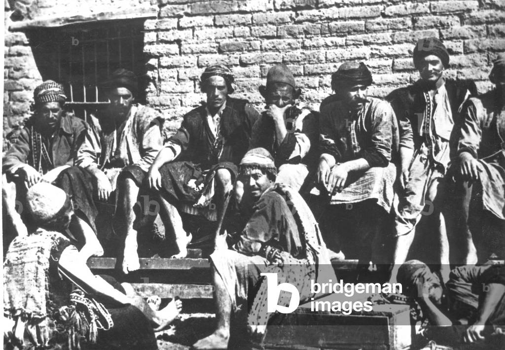 A group of Kurds waiting for work, Baghdad, Iraq, 1920-29 (b/w photo)
