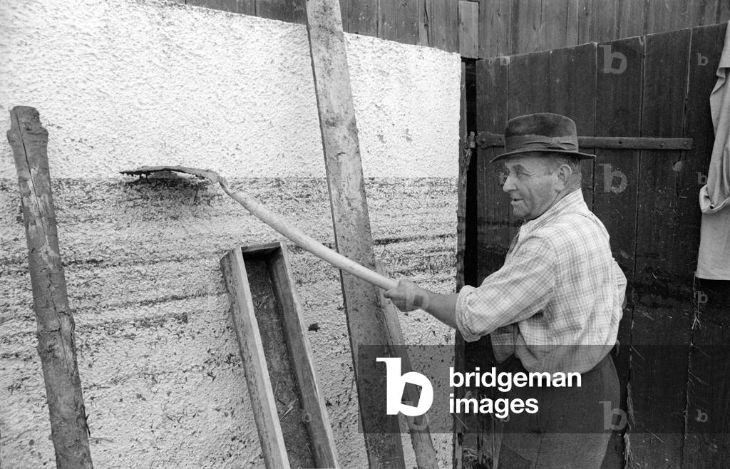 Cleaning up after a storm at Lake Chiemsee, 1974 (b/w photo)