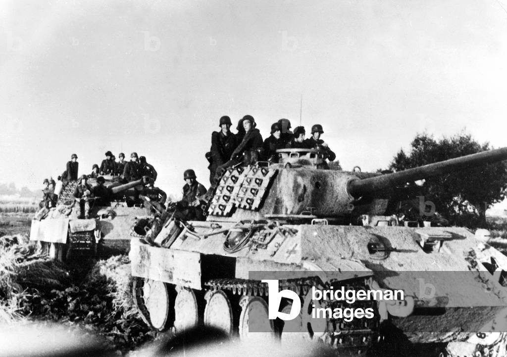 Two Panther tanks with infantry sitting on them (b/w photo)