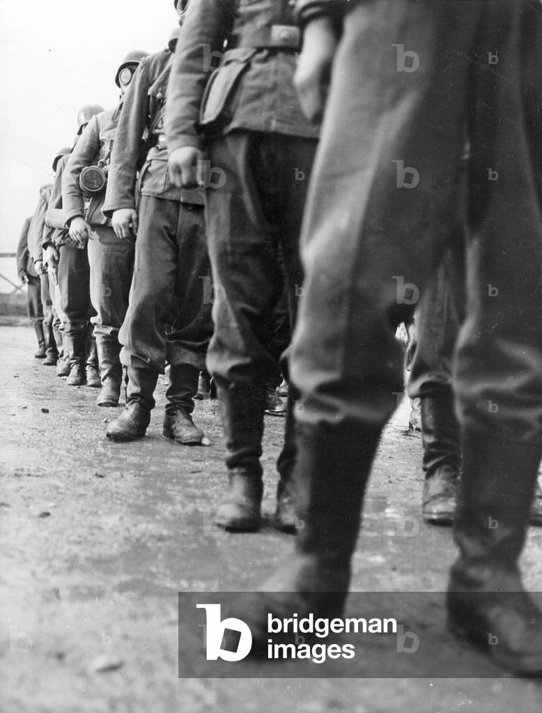 Soldiers in marching boots (b/w photo)