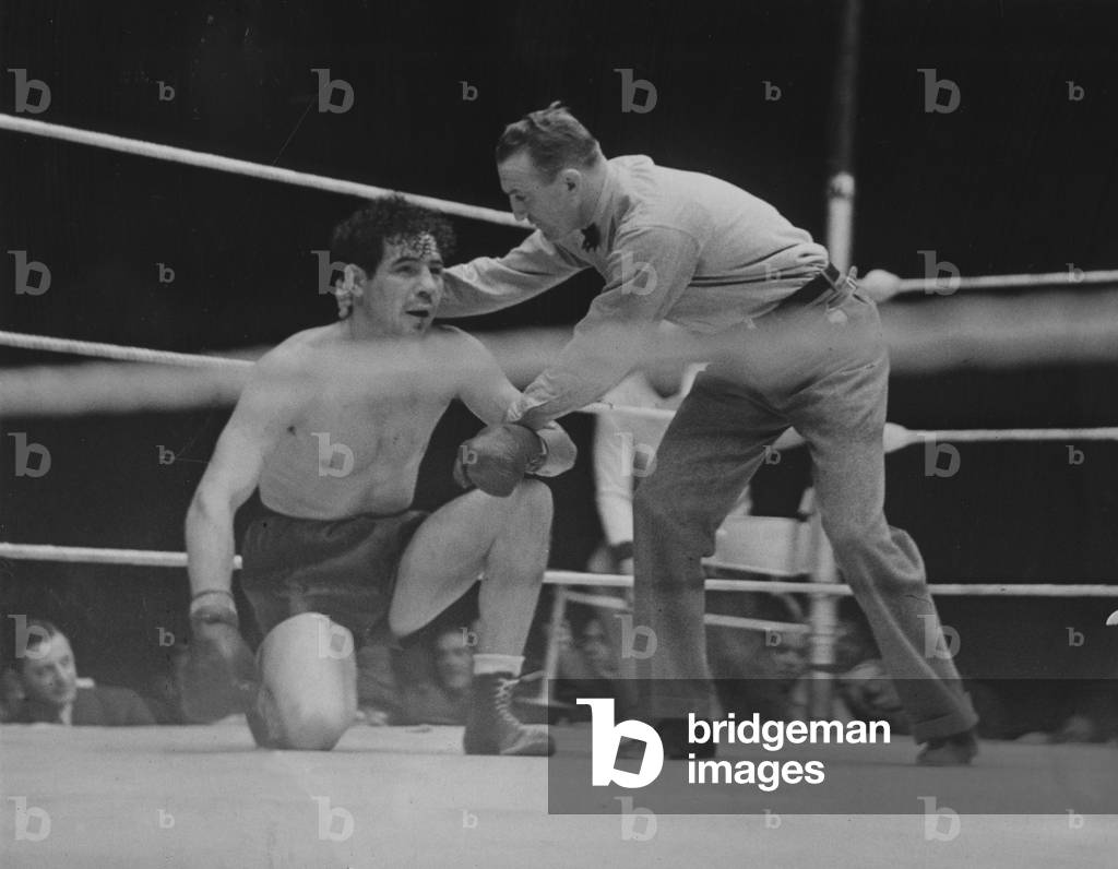 Max Baer on the ground, 1935 (b/w photo)