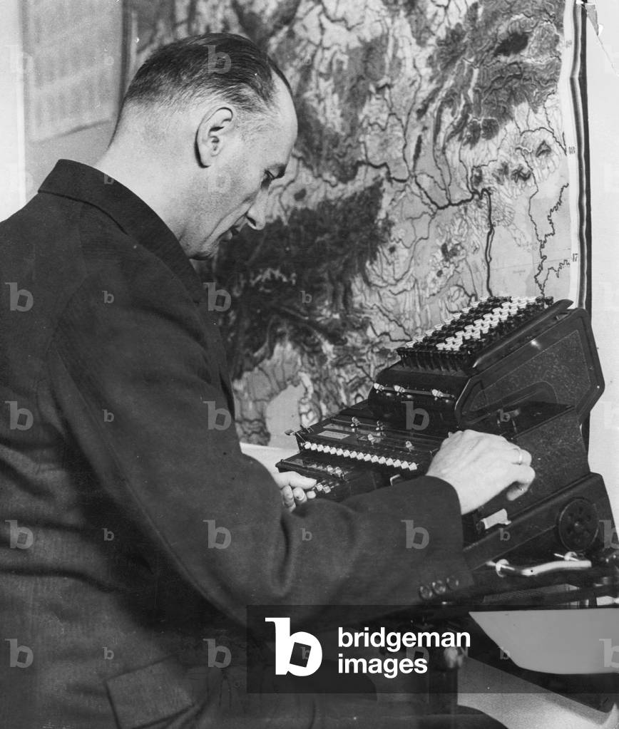 Calculator at a weather station, 1932 (b/w photo)