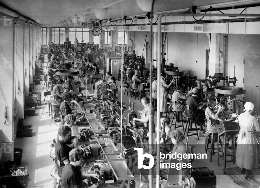 Assembly line work at Bosch, 1936 (b/w photo)
