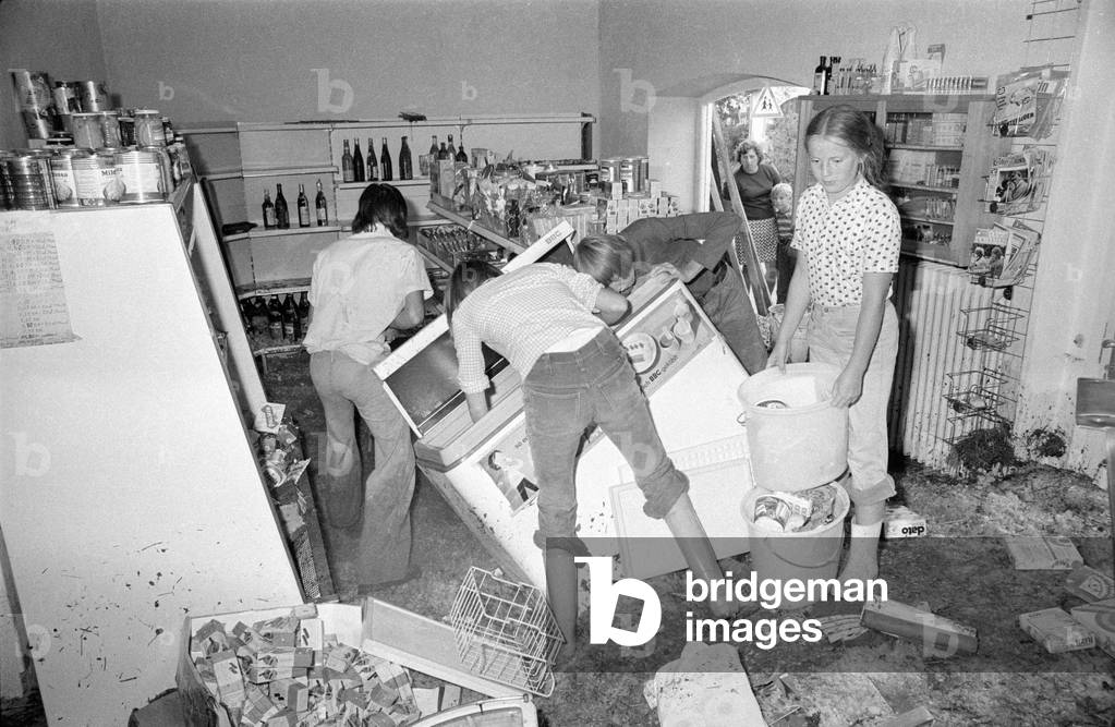 Cleaning up after a storm at Lake Chiemsee, 1974 (b/w photo)