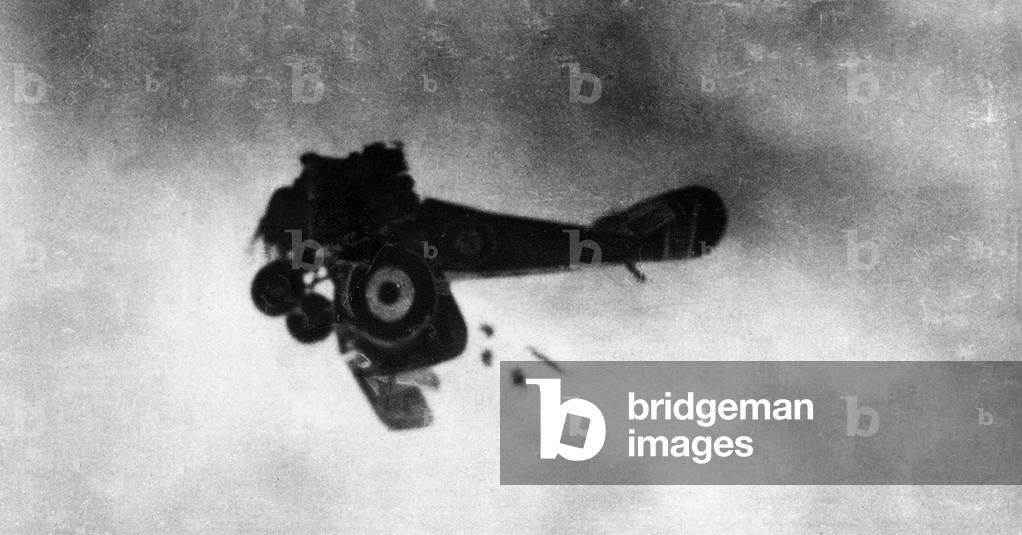 The wings of an English aeroplane, type Sopwith Camel, breaking during an aerial combat (b/w photo)
