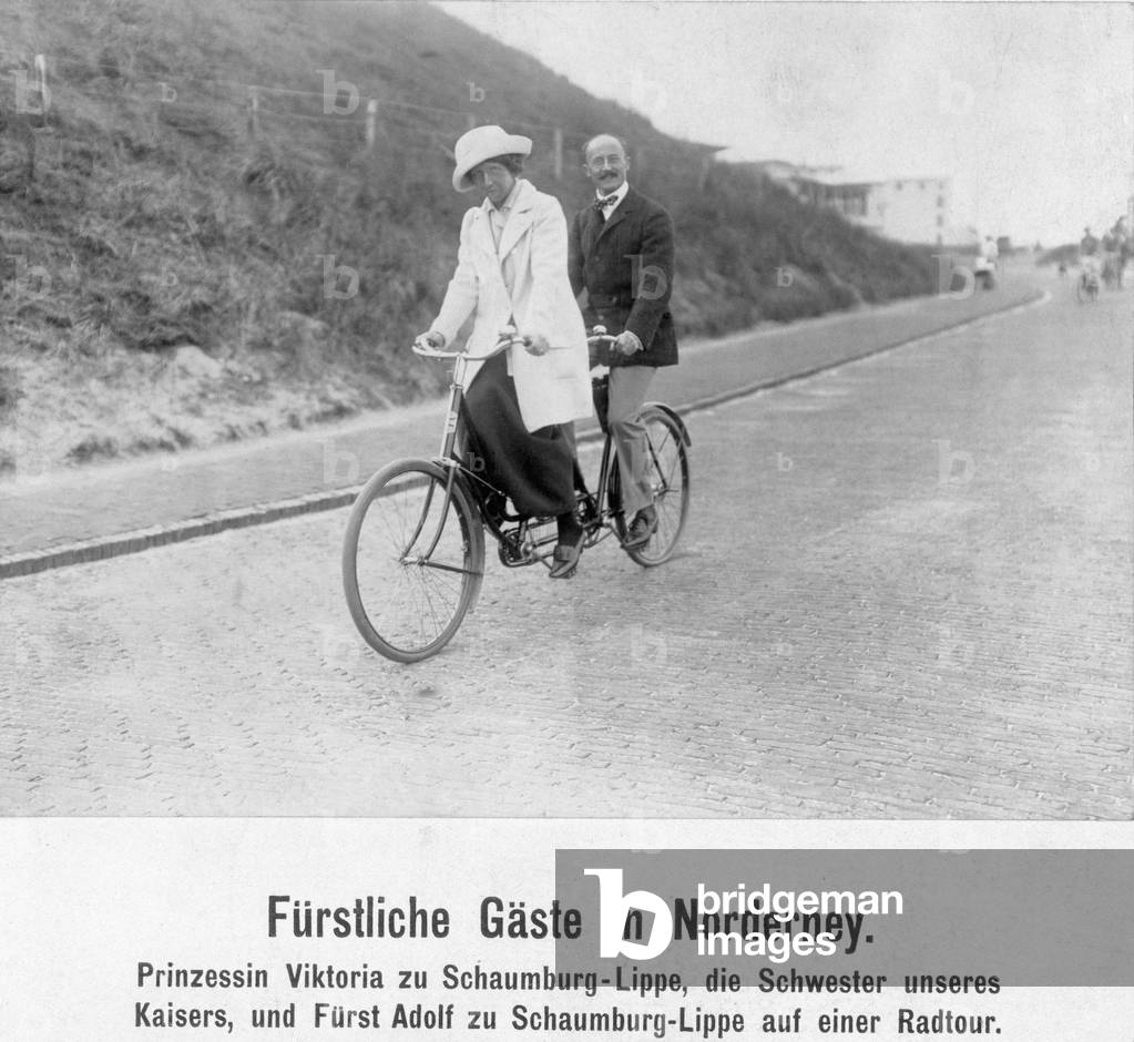 Viktoria of Schaumburg-Lippe with her husband on a tandem, 1913 (b/w photo)