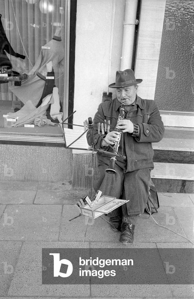 Street musician in Bonn, 1964 (b/w photo)
