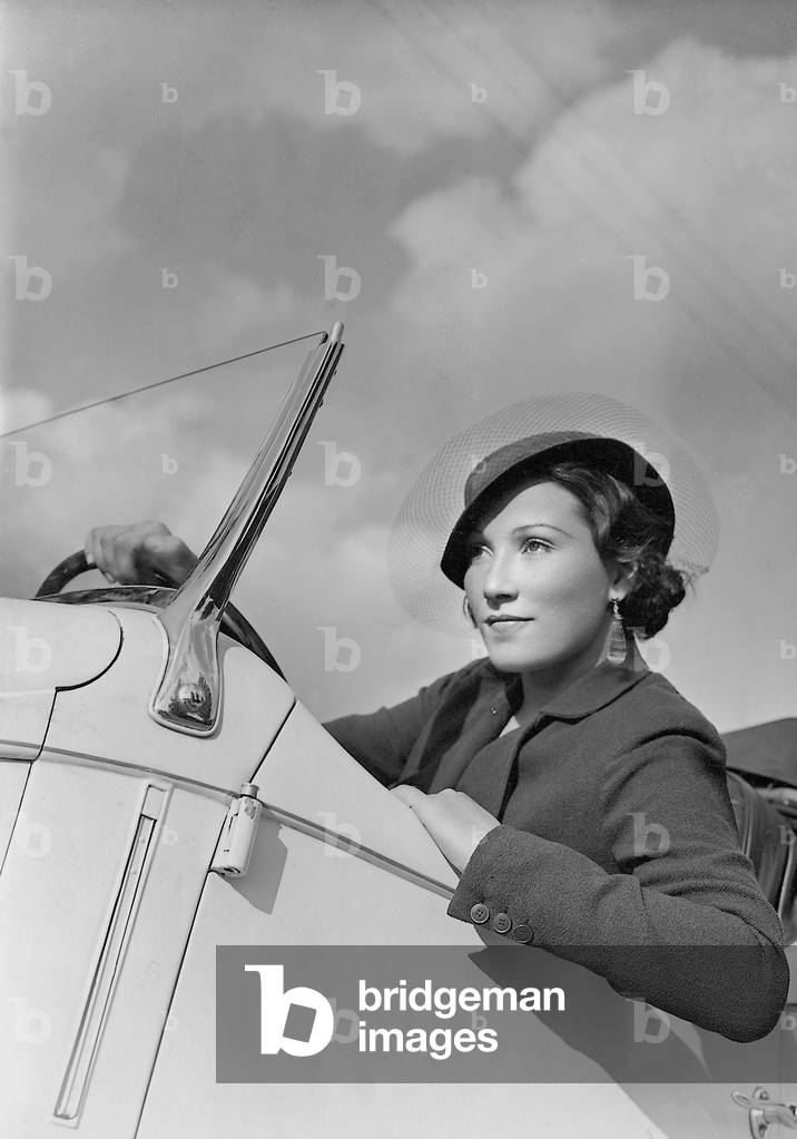 Brigitte Horney in her car (b/w photo)