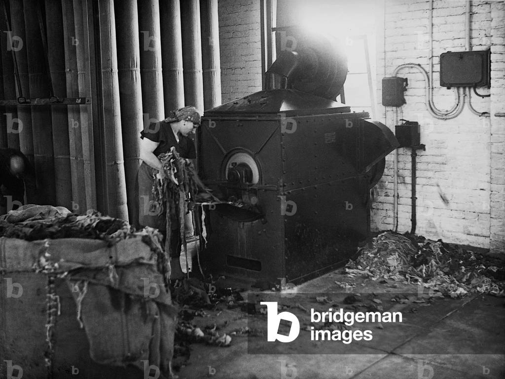 Recycling old clothes, 1940 (b/w photo)
