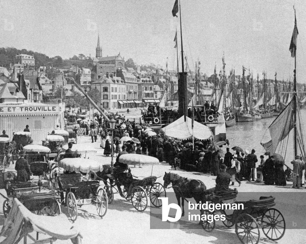 Holiday scene at the Quai Joinville in Trouville, around  1890