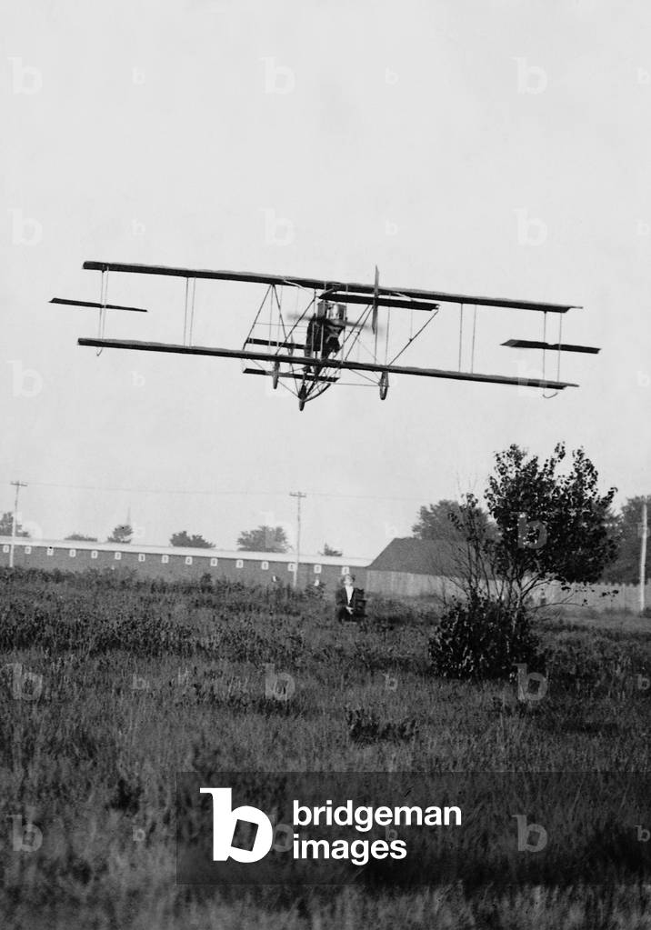 Glenn Curtiss in his plane, 1910 (b/w photo)
