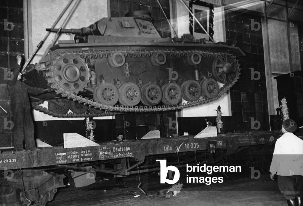 Loading of a tank in an armaments factory, 1940 (b/w photo)