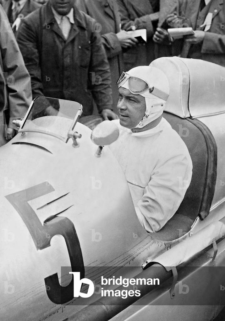 Rudolf Caracciola in a race car, 1935 (b/w photo)
