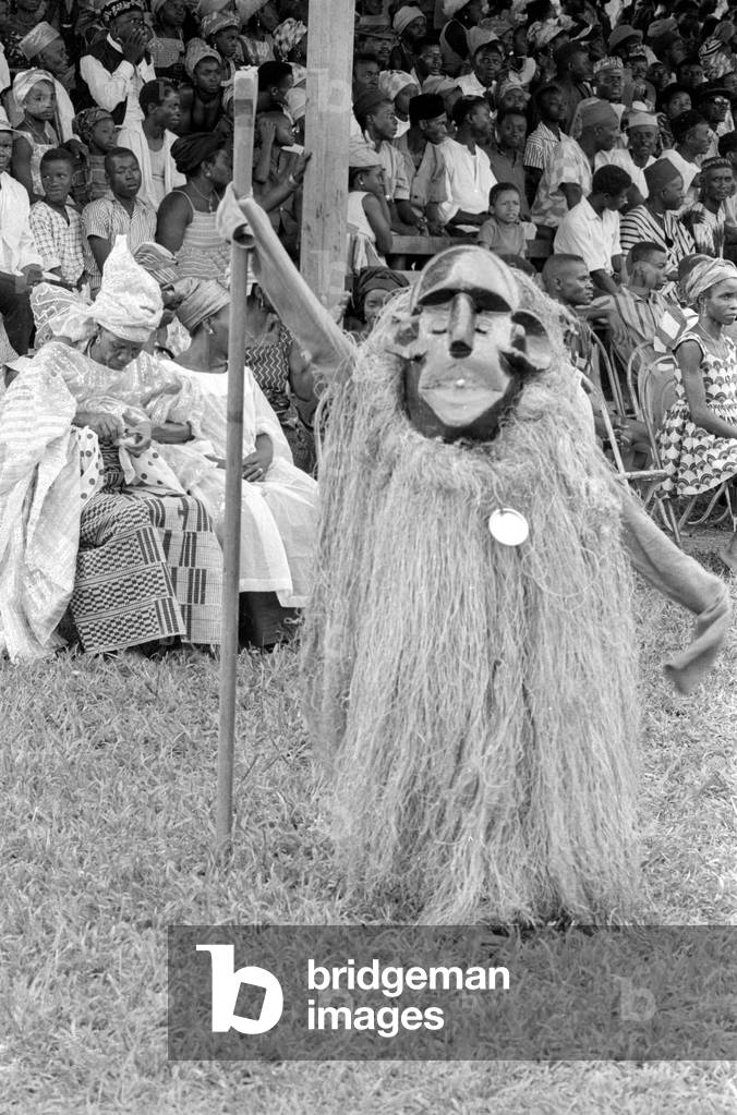 Monkey costume at a festival in Sierra Leone, 1965 (b/w photo)