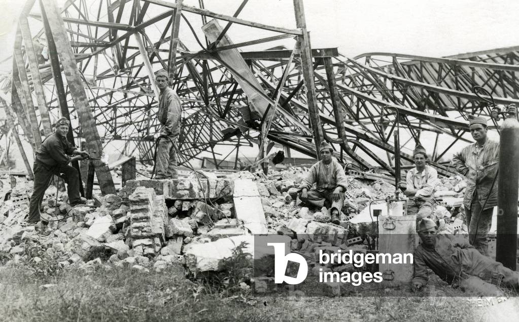 French soldiers dismantle a German hangar, around 1920