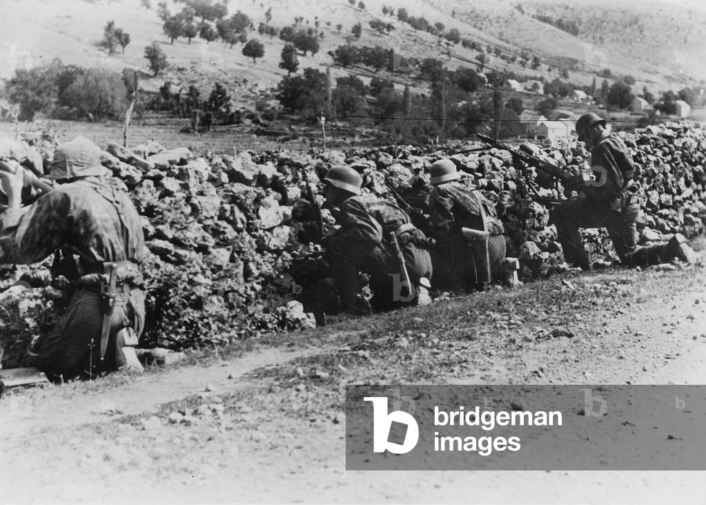 Soldiers of the Waffen-SS (weapon-SS) during a partisan attack, 1943 (b/w photo)