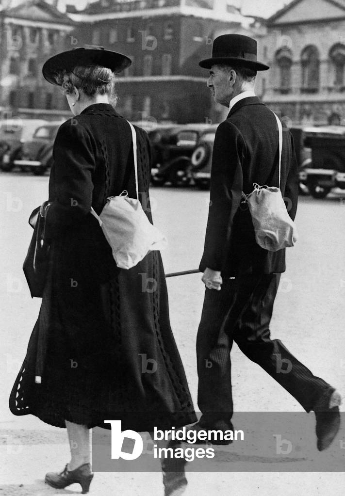 Arthur Neville Chamberlain and his wife with gas masks, 1939 (b/w photo)