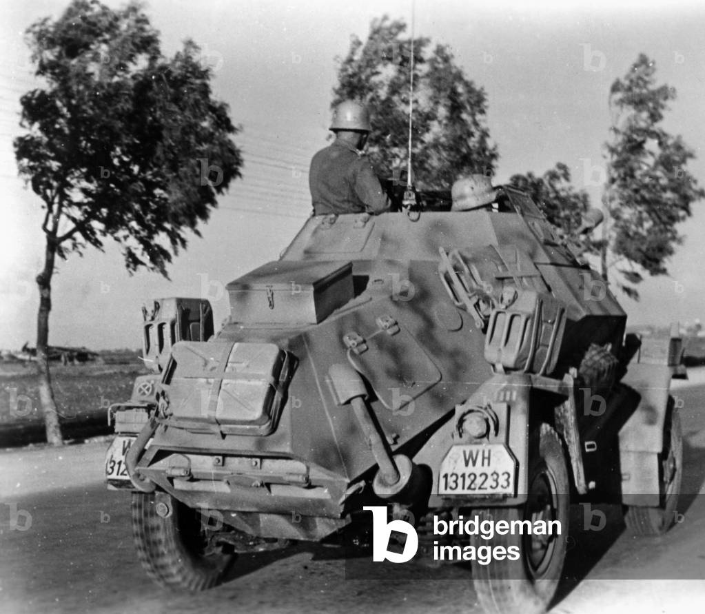 Troops operating a tank during military action in Tunisia, 1943 (b/w photo)