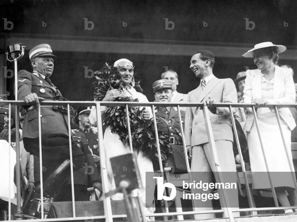 Reich Minister Dr. Josef Goebbels with wife Magda Goebbels and Herman Lang at the Avus race (b/w photo)