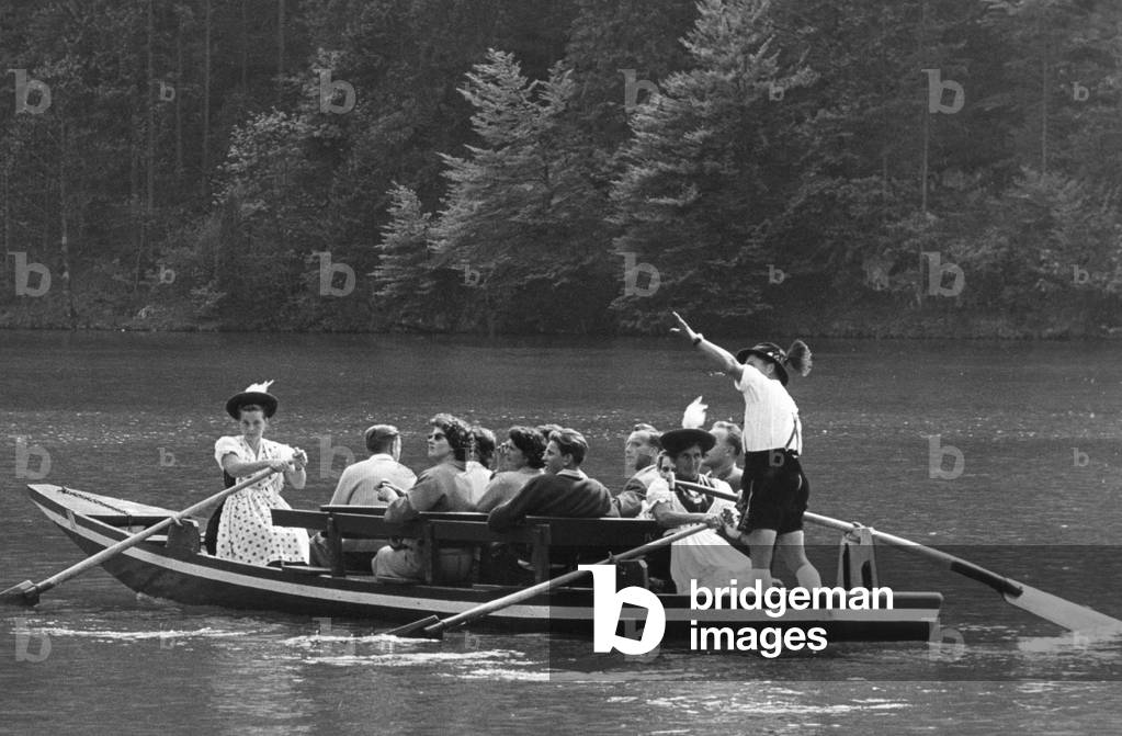 Tourists in a boat in lake Königssee (b/w photo)