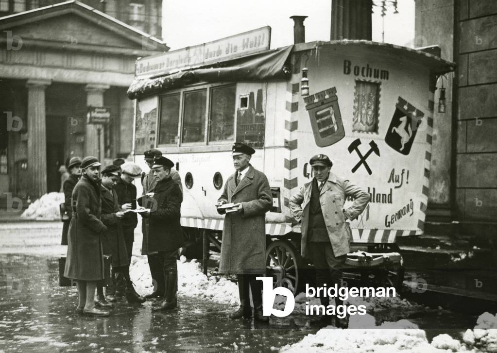 Four unemployed miners with their trailer at Leipziger Platz in Berlin, 1932