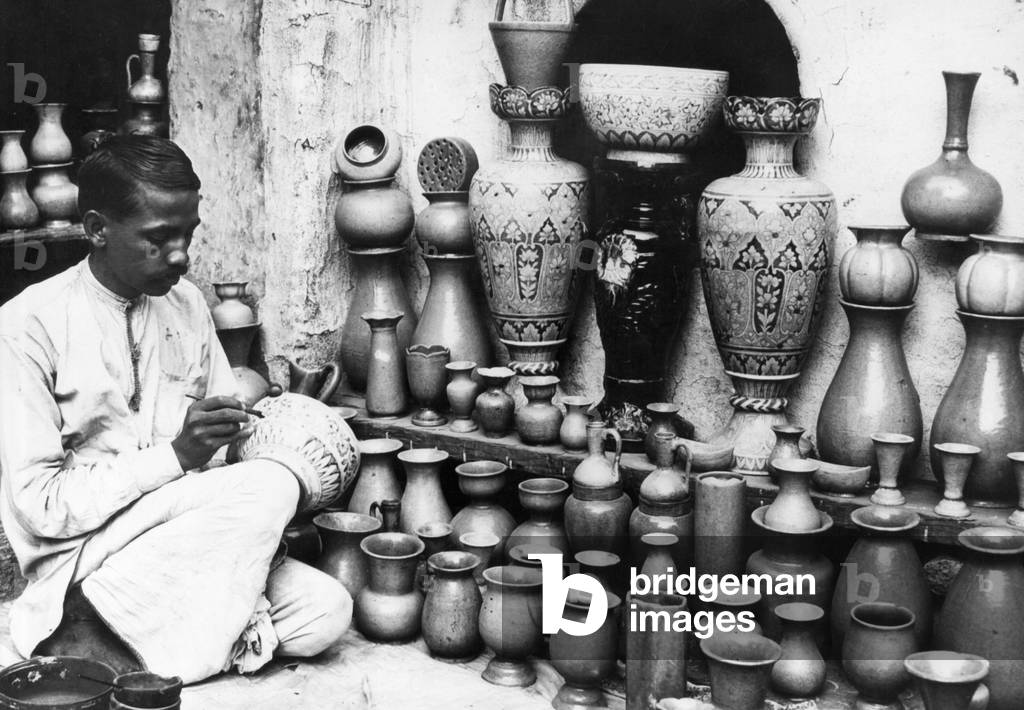 Indian porcelain painter, 1931 (b/w photo)