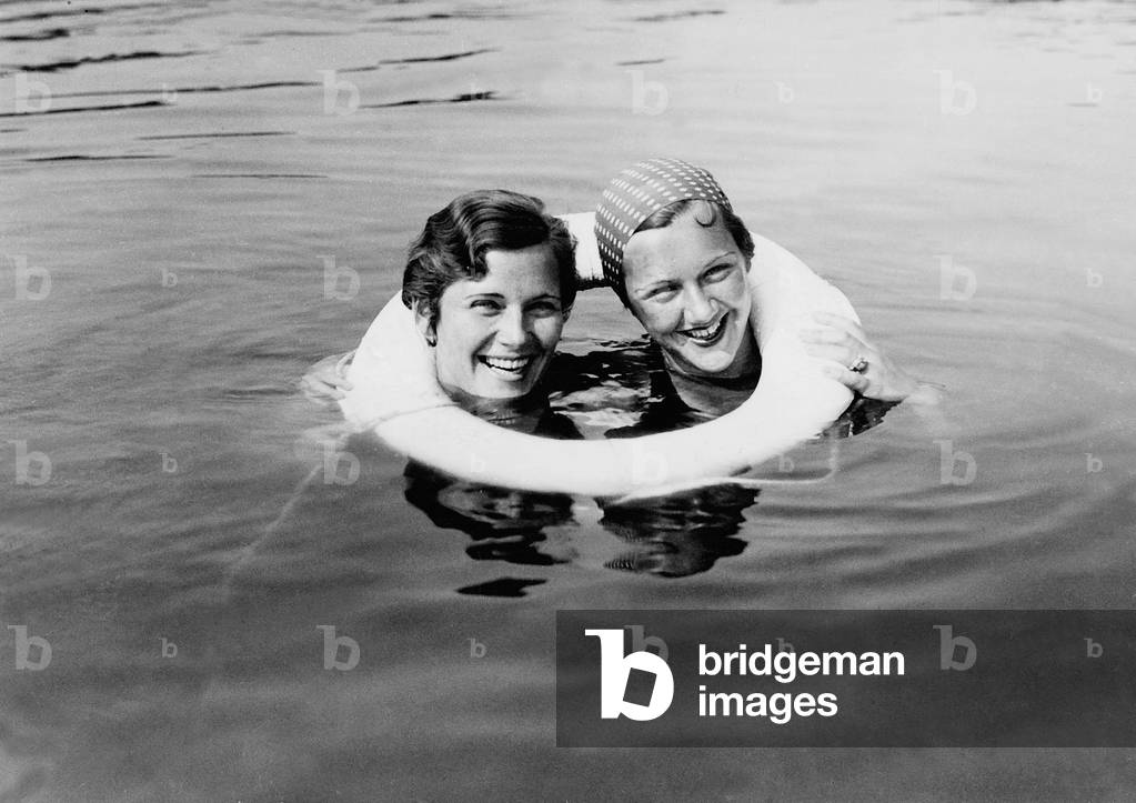 Olga and Ada Chekhova with a life belt, 1932 (b/w photo)