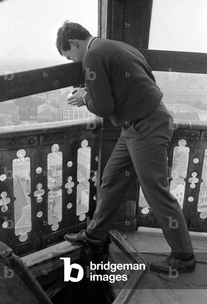Photographer on the tower of St. Mary's Church, 1963 (b/w photo)