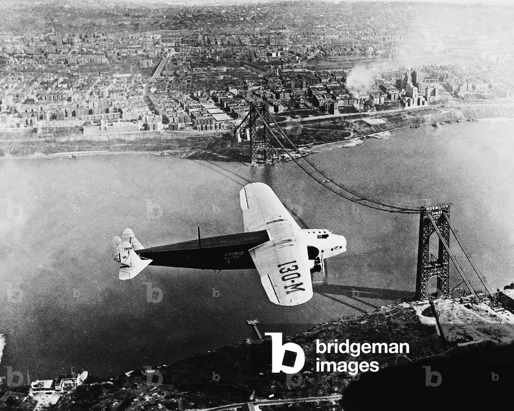 Airplane over the George Washington Bridge, 1930 (b/w photo)