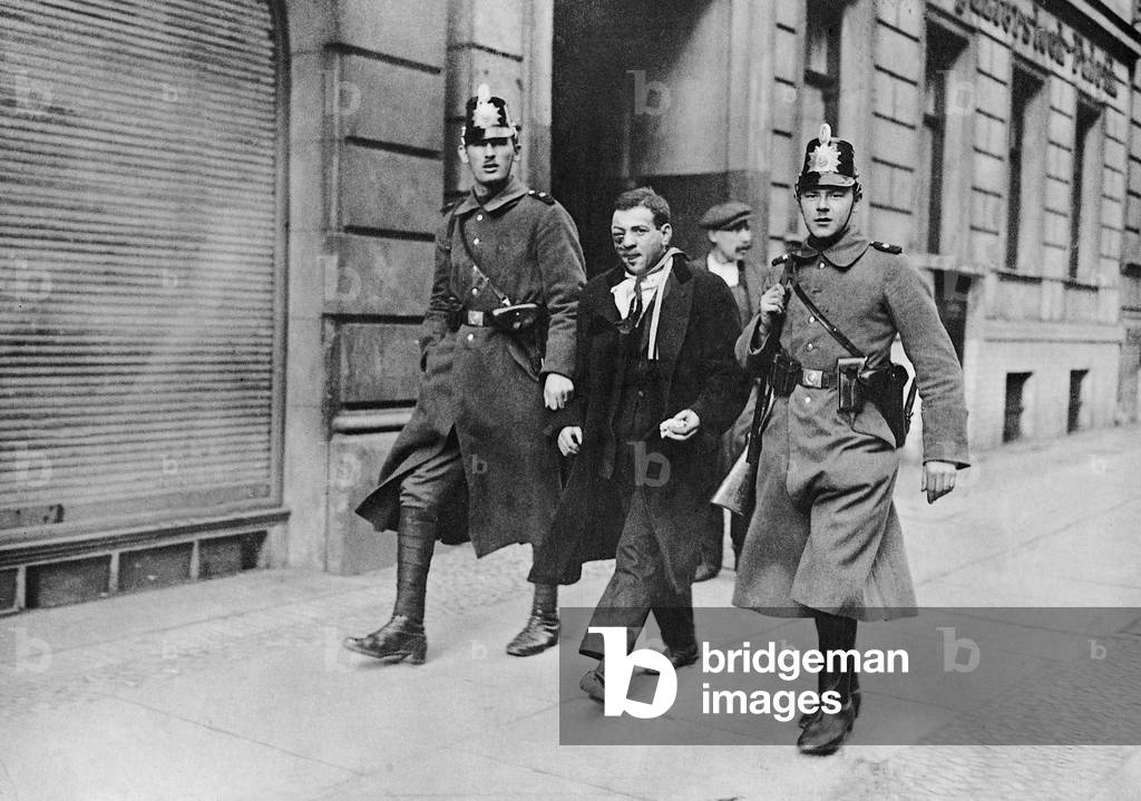 Man in police custody in Berlin, 1923 (b/w photo)