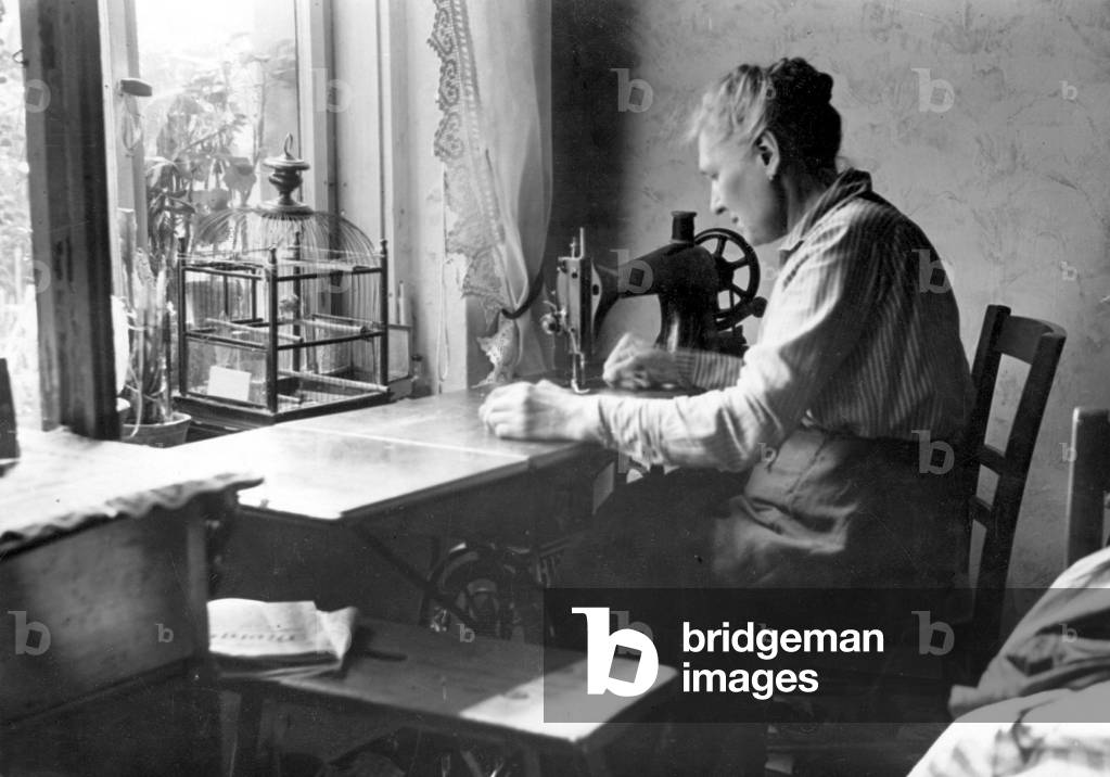 Woman working from home, 1931 (b/w photo)