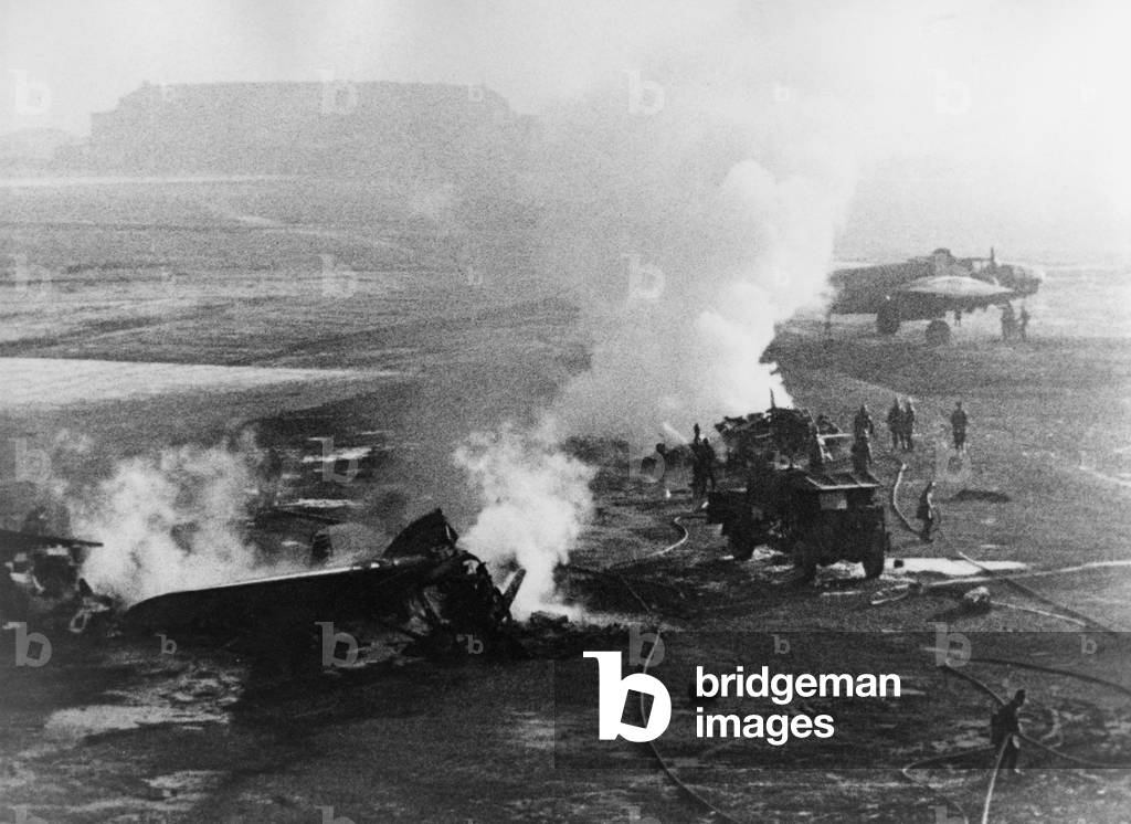 Destroyed aircraft after German airstrike in the area Holland-Belgium, 1945 (b/w photo)
