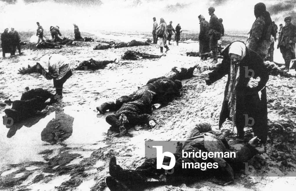Relatives are looking for dead family members on the Eastern Front, 1942 (b/w photo)