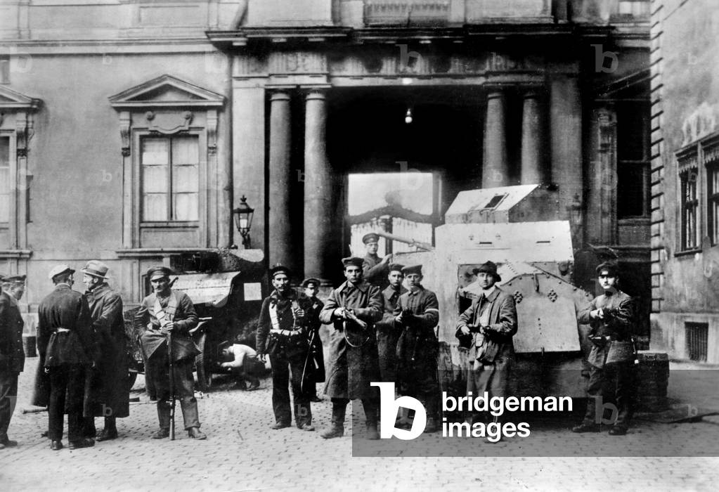 Revolutionaries with armored cars in the yard of the Berlin Palace, 1918 (b/w photo)