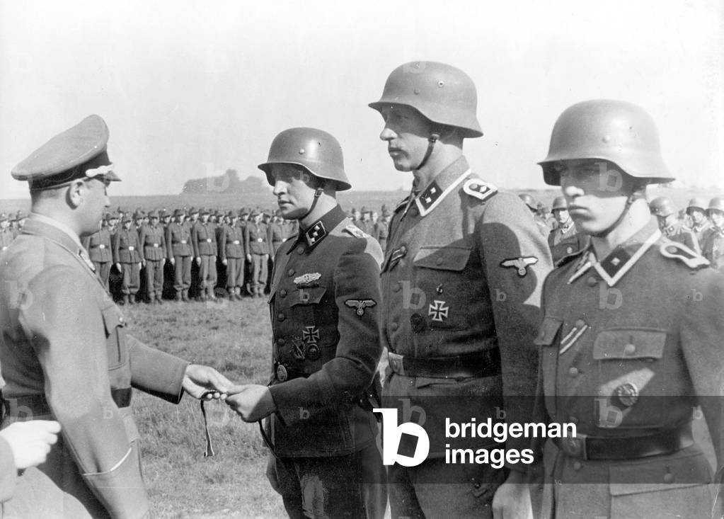 Artur Axmann gives 'armbands' to an SS Panzer Division 'Hitler Youth' (b/w photo)