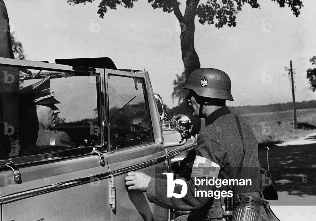 Adolf Hitler speaks with a soldier in Poland, 1939 (b/w photo)