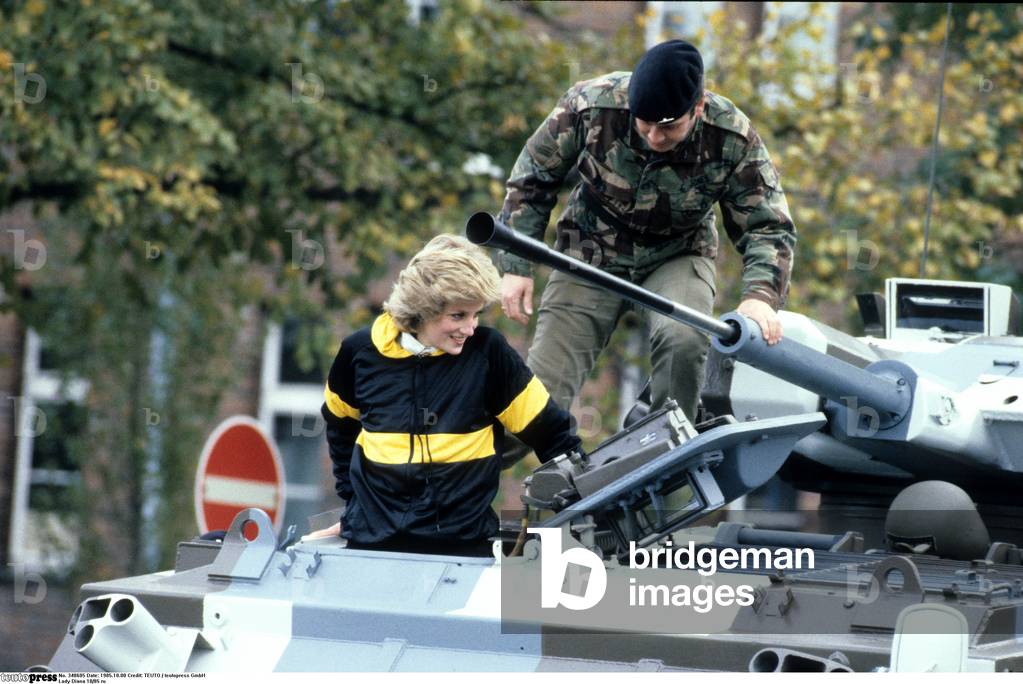 Lady Diana Princess of Wales 10/85 rud wife Princess England UK nobility wife of Prince Charles of Wales blond casual jacket armored soldier outside call half crosswise