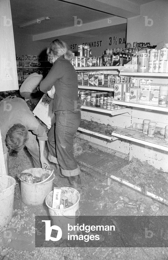 Cleaning up after a storm at Lake Chiemsee, 1974 (b/w photo)