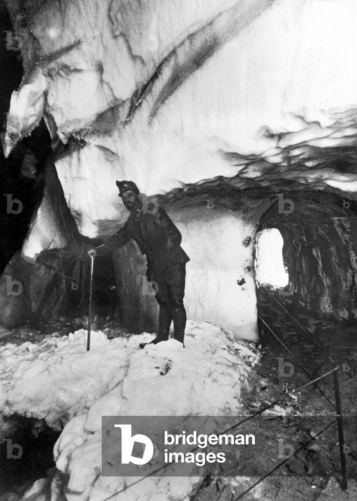 Austrian soldier in a glacier tunnel, 1918 (b/w photo)