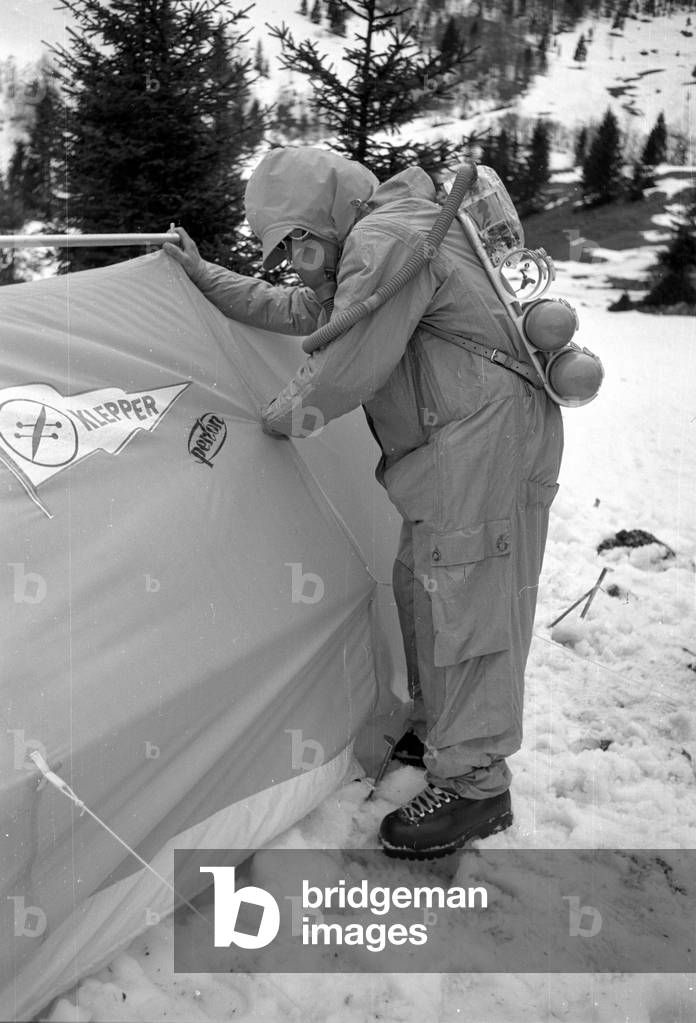 Mountaineer Mathias Rebitsch during preparations, 1954 (b/w photo)