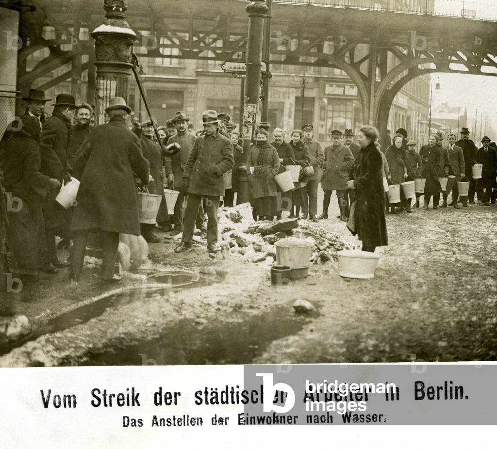 During the strikes of the Berlin workers, inhabitants of Berlin are waiting for water in the 1920s