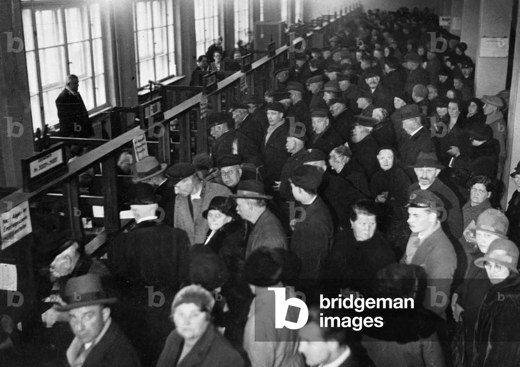 Unemployed people in an employment centre (b/w photo)