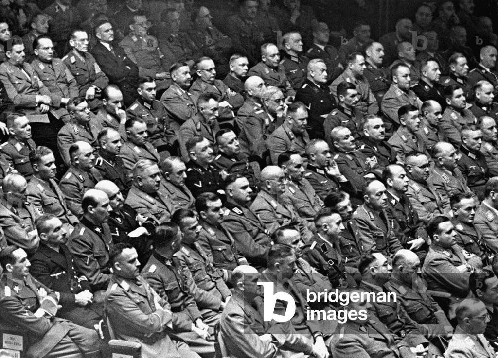 Members of the parliament during a speech of Adolf Hitler, 1941 (b/w photo)