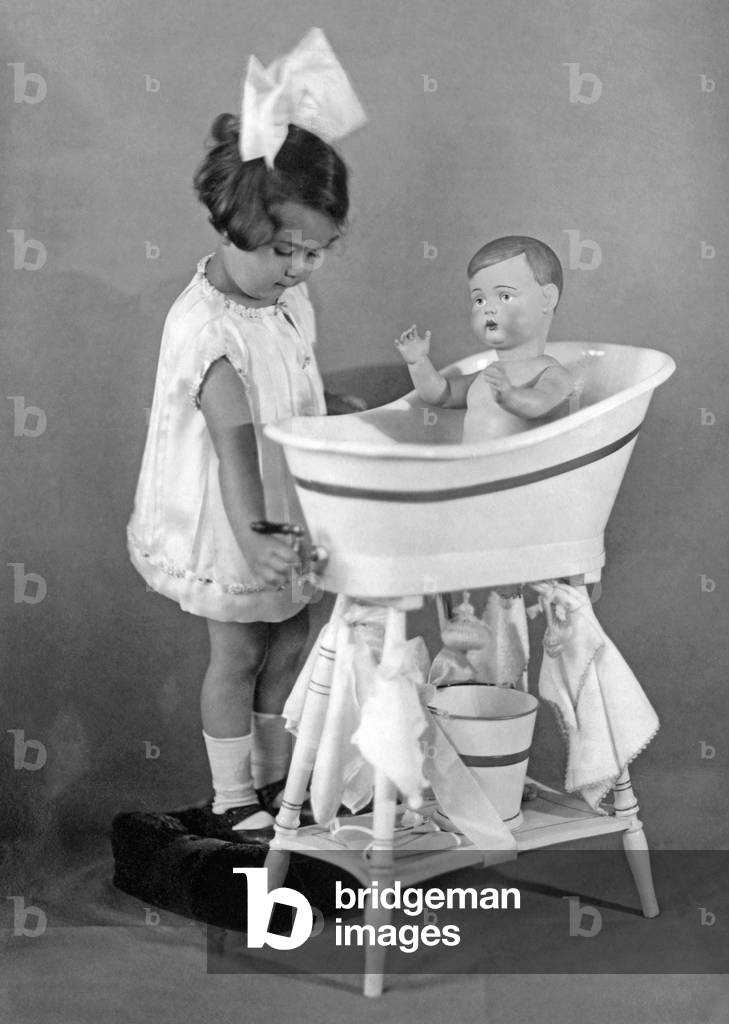 Child with doll, 1927