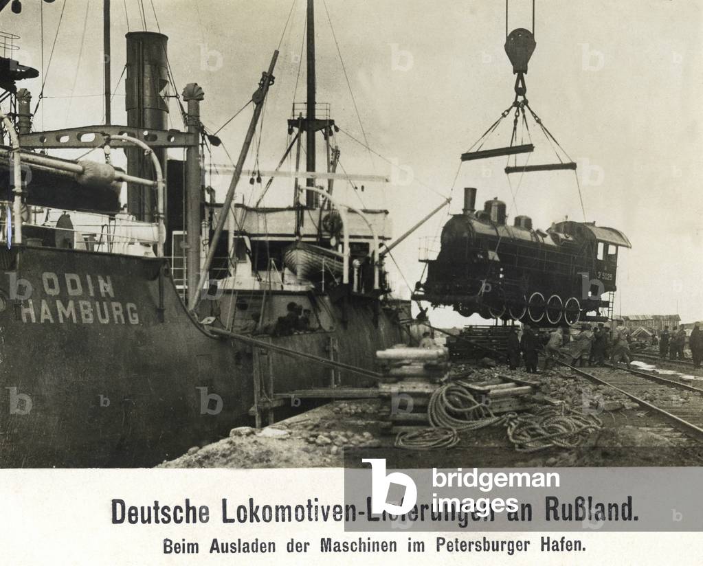 Unloading of a German locomotive in the St. Petersburg harbor, around the 1920s
