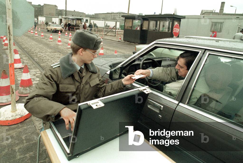 The Wall is down, but this east german border guard is doing his job on Potsdamer Platz. East german regime ends officially on 3rd October (photo)