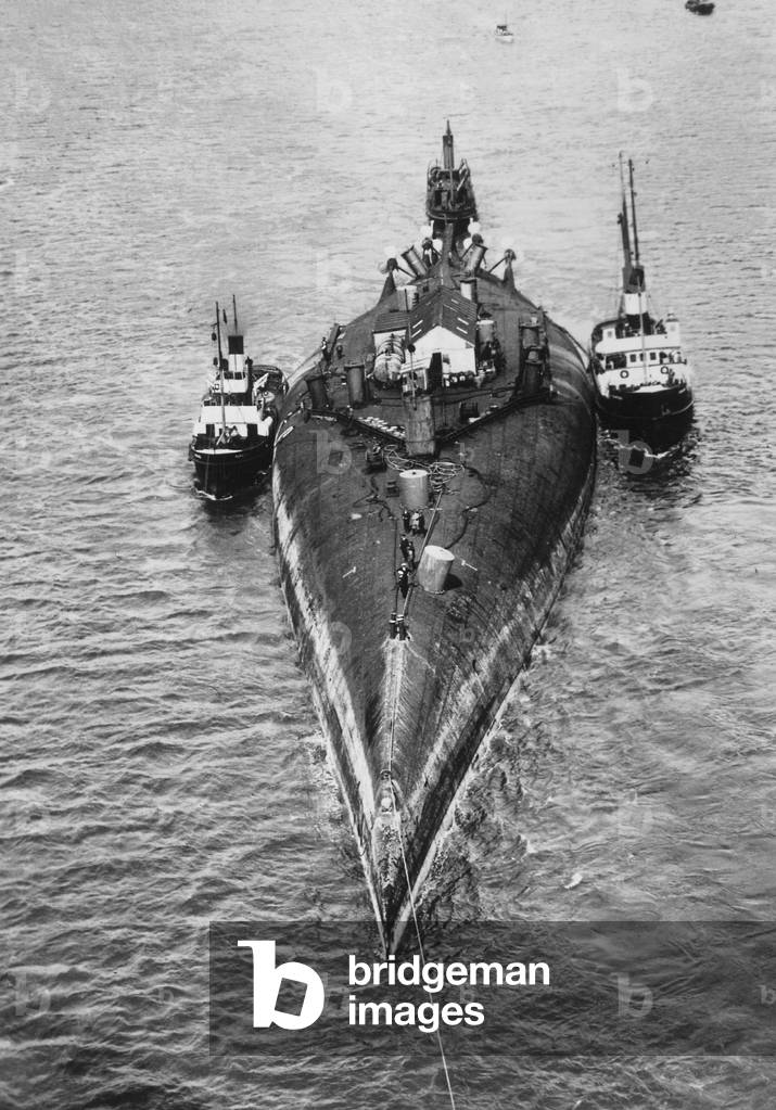 German war ship is taken to be broken up, 1934 (b/w photo)