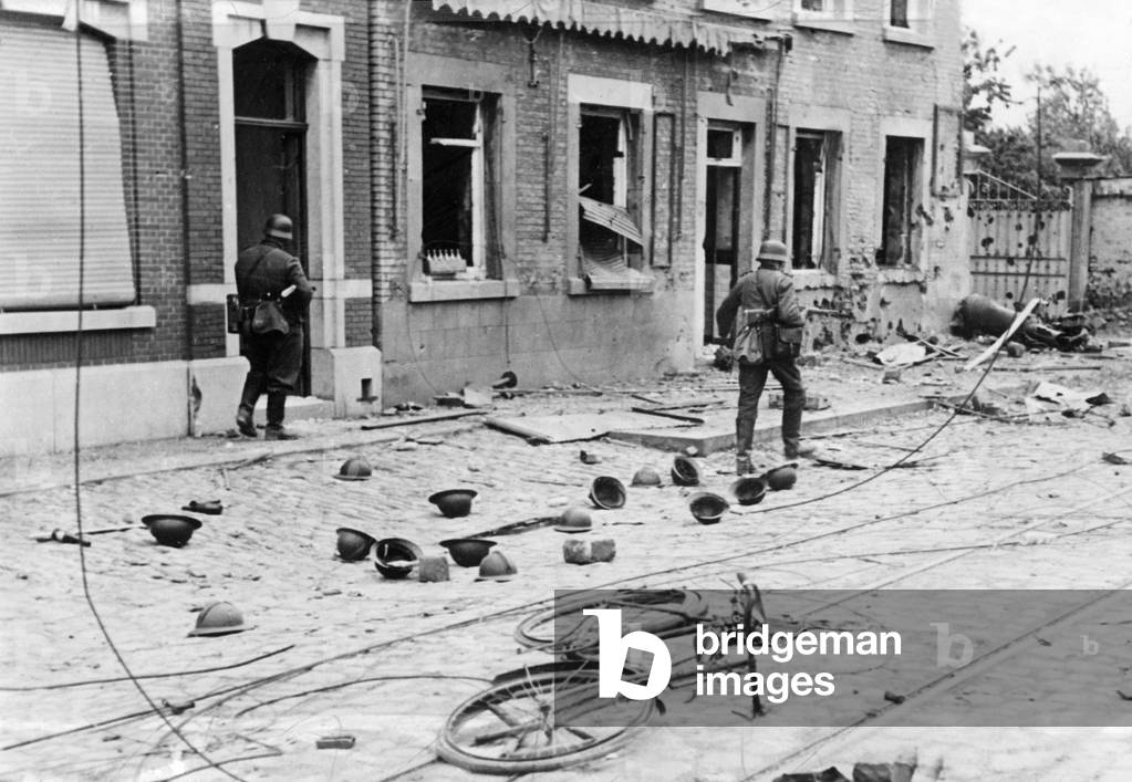 German infantry in a French city, 1940